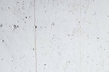 abstract texture of light concrete wall with cracks and scratches, background for copy space 