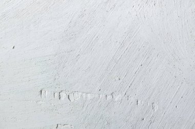 abstract texture of light concrete wall with cracks and scratches, background for copy space 