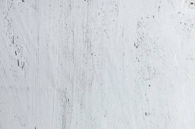 wall with cracks. texture of light concrete cement with scratches, background for copy space 