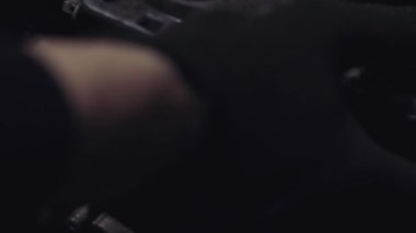 auto mechanic repairing car motor, close up, cropped video shooting 