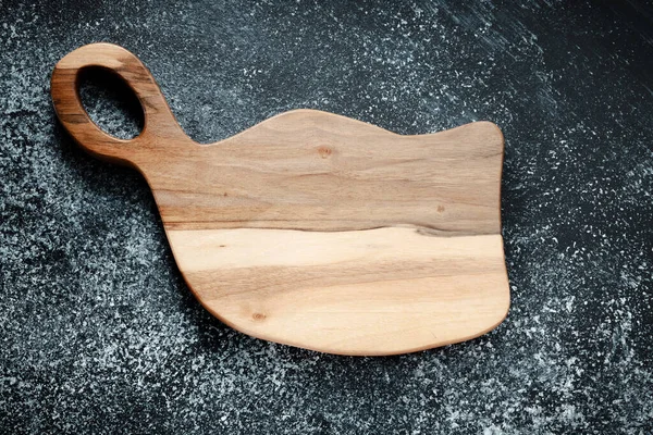 Vintage cutting board. Accessories for cooking at home. Board for cutting products. Cutting board for steaks. Product from different types of wood.