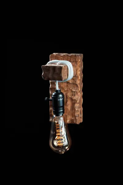 Vintage wall lamp to illuminate the terrace. Antique lamp with Edison bulb. The concept of saving energy or lack of ideas. Turned off lamp on a dark background.