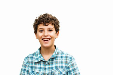 A 10-year-old boy wearing a checkered shirt, with a big smile on his face, looking directly at the camera. He is isolated from the background and captured in a shoulder-up shot. clipart