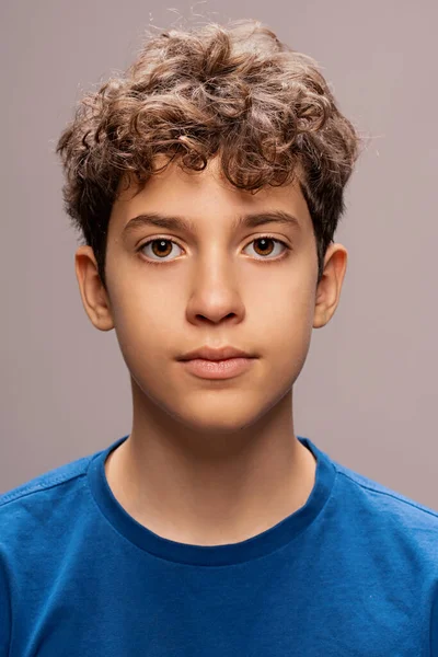 Portrait Young Teen Boy Showcasing Pensive Expression Curly Hair Prominently — Stock Photo, Image