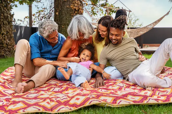 Multi Generational Interracial Family Shares Laughs Love Colorful Picnic Blanket — Stock Photo, Image