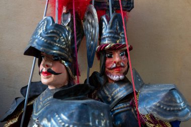 Catania, Italy - November 24, 2024 - Close-up of traditional Sicilian puppets (pupi) on display, representing the islands iconic puppet theatre tradition, a cultural heritage of Sicily. clipart