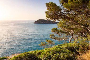 View to little island Campi seen from coastal road from Vieste to Mattinata at Gargano National Park, Apulia, Italy