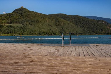 Lake view from the swimming pier at Lake Caldaro Italy.  clipart
