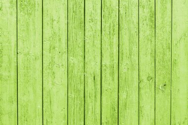 Dikey yeşil çizgiler. Yeşil soyulmuş tahta döşeme dokusu. Açık havada, yıpranmış yazlık duvarda..
