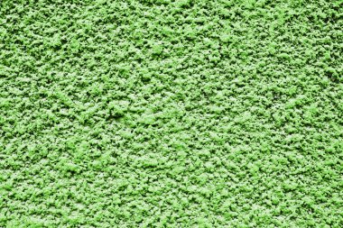 Ön cephe dokusu. Yeşil kaba yüzey. Çamur taneleri. Duvardaki taşları kırdım. Evin dış dekorasyonu. Stucco duvar deseni.