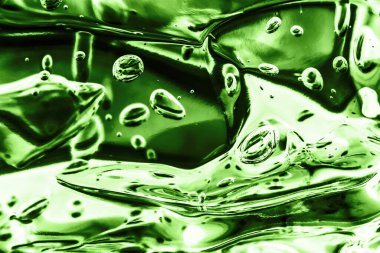 Yeşil spa sağlık jeli. Makro şeffaf baloncuk desenli arka plan. Köpüklü su soyut sıvı hava kabarcığı.