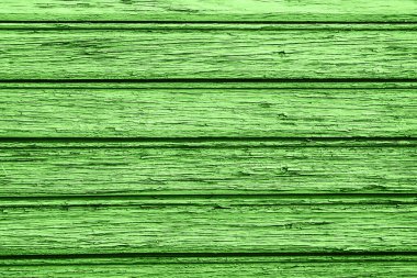Parlak yeşil ahşap doku. Güçlü renklerle boyanmış ahşap. Doğal kırsal yüzey arka planı. Tahıllı organik desen. Yatay çizgileri olan eski bir kereste. Dekoratif ahşap arkaplan resmi.