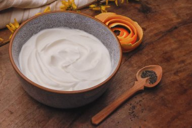 Bowl with Greek yogurt and fruit with nuts, seeds