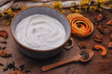 Bowl with Greek yogurt and fruit with nuts, seeds