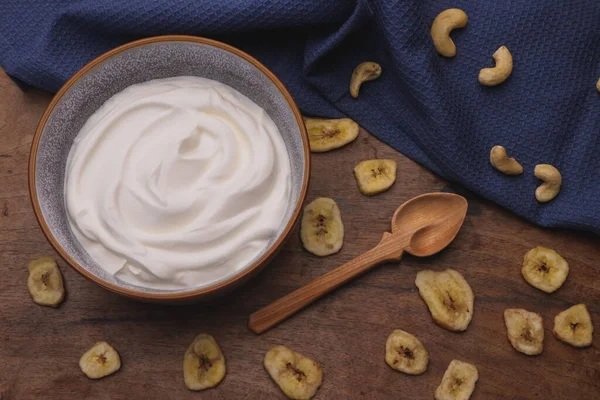 stock image Bowl with Greek yogurt and fruit with nuts, seeds