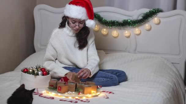 Beautiful Caucasian Teenage Girl Santa Claus Hat Takes Box Advent — Stock Video