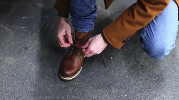 Young Caucasian Man Brown Coat Laces New Shoe His Leg — Video