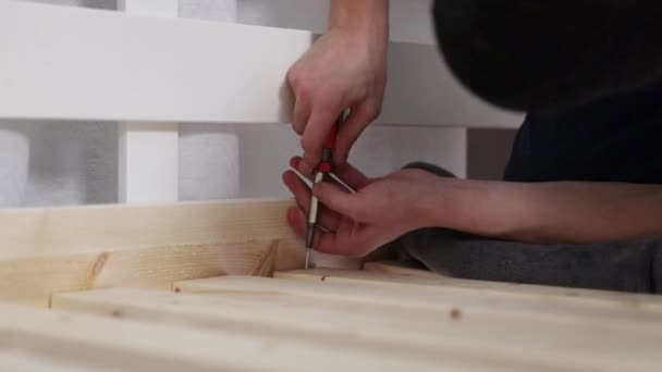 One Young Unrecognizable Man Manually Tightens Screw Thin Frame Frame — Stock Video