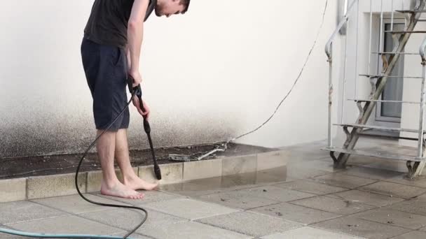 One Young Handsome Brunette Caucasian Man Washes Dirty Tiles Strong — Stock Video