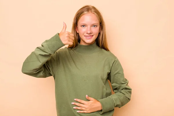 Caucásico Adolescente Chica Aislado Beige Fondo Toca Panza Sonríe Suavemente — Foto de Stock