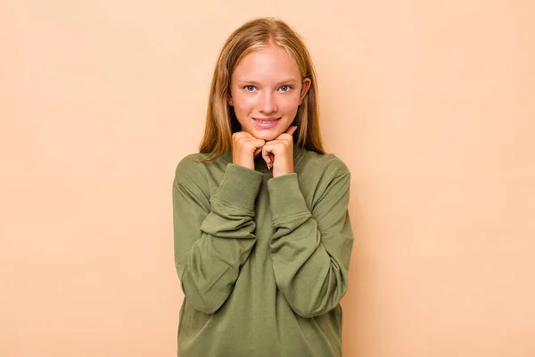 Caucasian Teen Girl Isolated Beige Background Keeps Hands Chin Looking — Stock Photo, Image