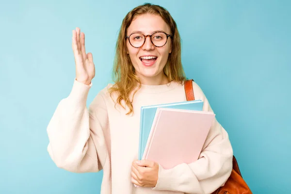 Young Student Caucasian Woman Isolated Blue Background Receiving Pleasant Surprise — Stock Photo, Image