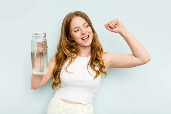 Young Caucasian Woman Holding Jar Water Isolated Blue Background Raising — Stock Photo, Image