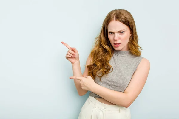 Young Caucasian Woman Isolated Blue Background Pointing Forefingers Copy Space — Stock Photo, Image