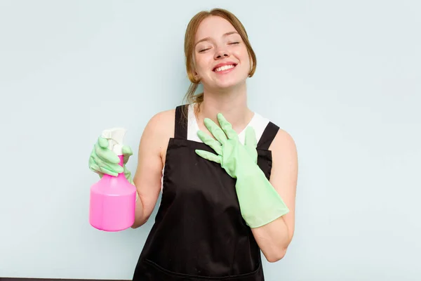 Young Cleaner Woman Isolated Blue Background Laughs Out Loudly Keeping — Stock Photo, Image