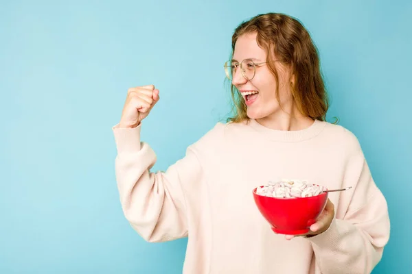 Young Caucasian Woman Holding Bowl Cereals Isolated Blue Background Raising — Stock Photo, Image