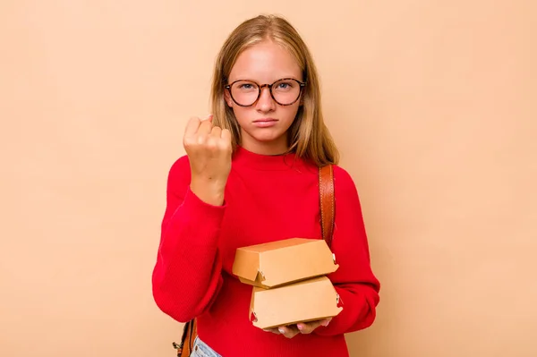 Little Caucasian Student Girl Holding Burgers Isolated Beige Background Showing — Stock Photo, Image
