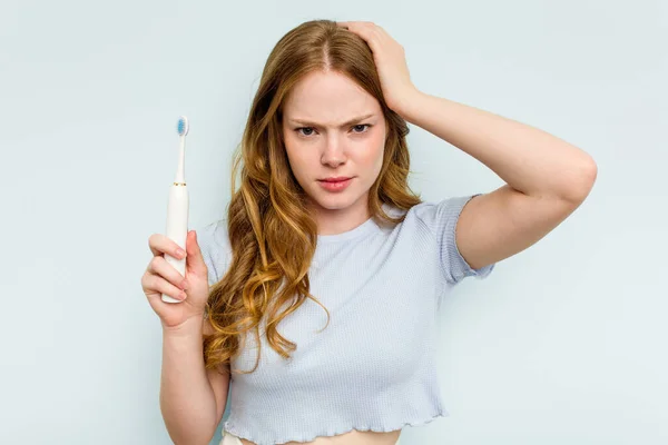 Young Caucasian Woman Holding Electric Toothbrush Isolated Blue Background Being — Stock Photo, Image