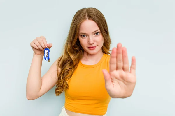 Young Caucasian Woman Holding Home Keys Isolated Blue Background Standing — Stok fotoğraf
