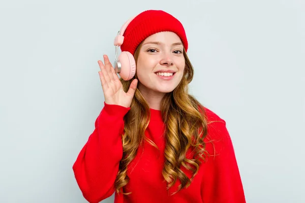 stock image Young caucasian woman wearing headphones isolated on blue background