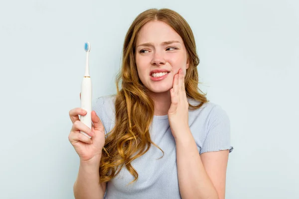 Young Caucasian Woman Holding Electric Toothbrush Isolated Blue Background — Stock Photo, Image