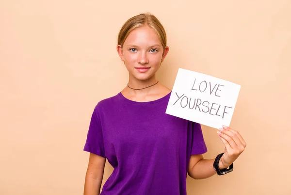 Little Caucasian Woman Holding Love Yourself Placard Isolated Beige Background — Stock Photo, Image