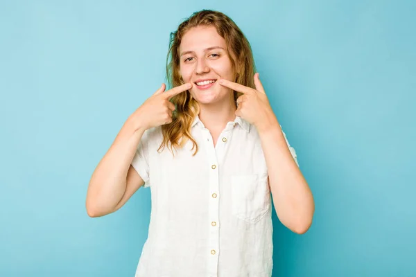 Young Caucasian Woman Isolated Blue Background Smiles Pointing Fingers Mouth — Stock Photo, Image
