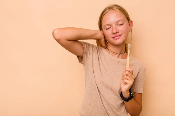 Caucasian Teen Girl Brushing Teeth Isolated Beige Background Touching Back — Stock Photo, Image