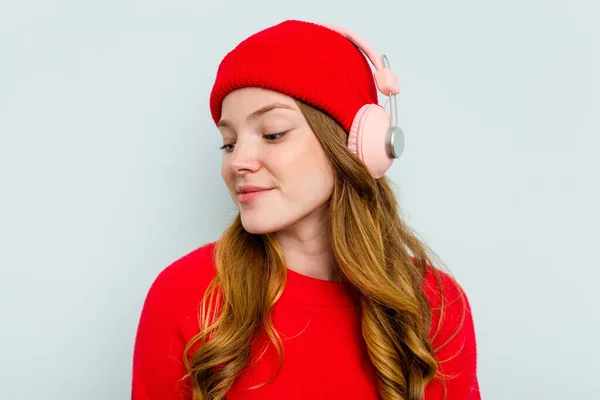 stock image Young caucasian woman wearing headphones isolated on blue background