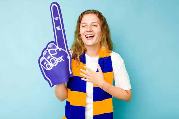 Young Caucasian Sports Fan Woman Isolated Blue Background Laughs Out — Stock Photo, Image
