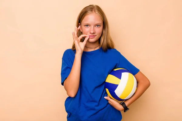 Little Caucasian Girl Playing Volleyball Isolated Beige Background Fingers Lips — Stock Photo, Image