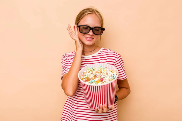 Little Caucasian Girl Eating Popcorn Isolated Beige Background Covering Ears — Stock Photo, Image