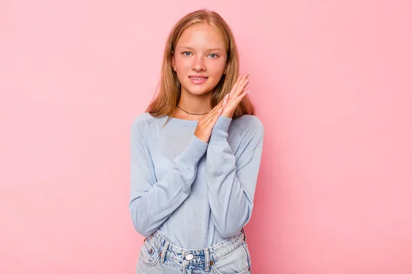 stock image Caucasian teen girl isolated on pink background feeling energetic and comfortable, rubbing hands confident.