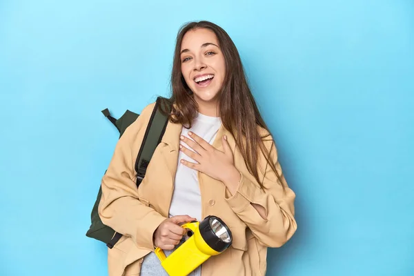 Adventurous Woman Flashlight Backpack Ready Explore Laughs Out Loudly Keeping — Stock Photo, Image