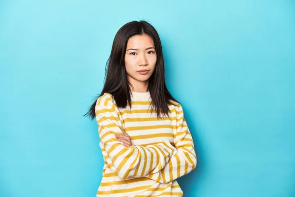 Asian Woman Striped Yellow Sweater Suspicious Uncertain Examining You — Stock Photo, Image