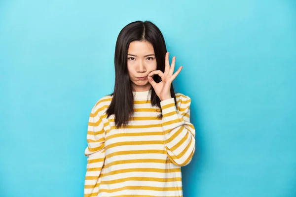 Asian Woman Striped Yellow Sweater Fingers Lips Keeping Secret — Stock Photo, Image