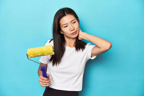 Young Asian Woman Paint Roller Diy Concept Touching Back Head — Stock Photo, Image