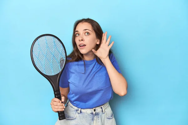 Woman Electric Bug Zapper Blue Background Trying Listening Gossip — Stock Photo, Image