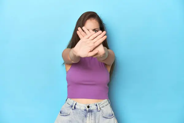 Fashionable Young Woman Purple Top Blue Background Doing Denial Gesture — Stock Photo, Image