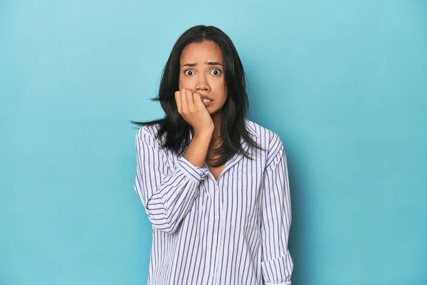 Filipina Young Woman Blue Studio Biting Fingernails Nervous Very Anxious — Stock Photo, Image